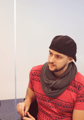 Portrait of Andrés sitting on a chair and looking to someone who is not in the picture