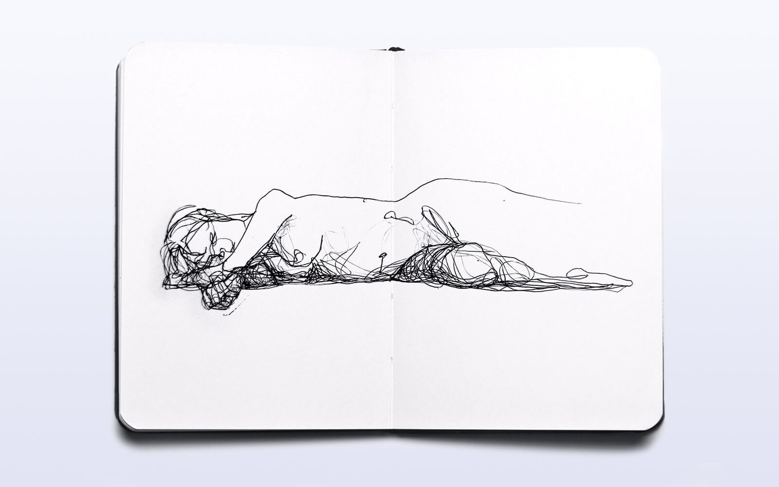 A simple sketch depicting a woman lying on her stomach, exuding calmness and tranquility in her pose